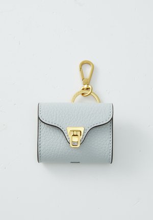 Light blue leather keychain wallet with gold hardware, featuring a clasp and a decorative keyring. Textured surface with a curved flap design.