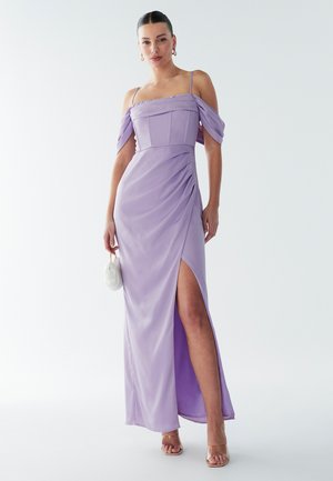 Lavender satin dress with off-the-shoulder sleeves, draped detailing, and a thigh-high slit. Features a fitted bodice and flowing skirt.