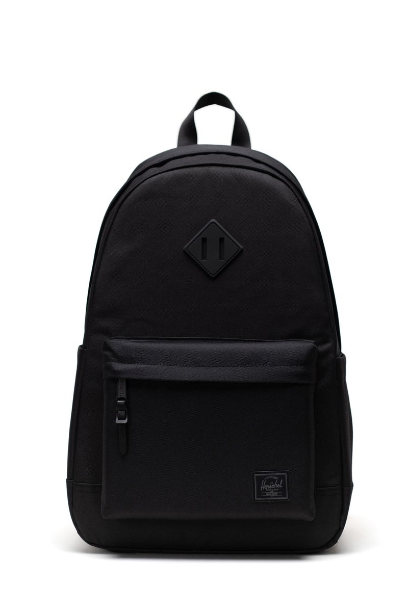 Black backpack made of durable fabric, featuring a diamond logo, front zip pocket, and padded shoulder straps. Simple, functional design.
