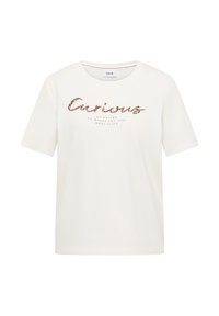 T-shirt blanc à manches courtes avec col rond, arborant en script pailleté le mot "Curious" et un texte plus petit en dessous sur le devant.