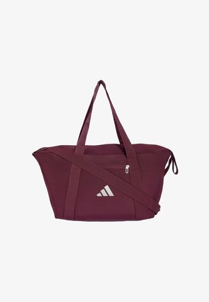 Bolsa de deporte Adidas color burdeos con dos asas superiores, una correa de hombro ajustable, bolsillo delantero con cremallera y logo blanco de Adidas.
