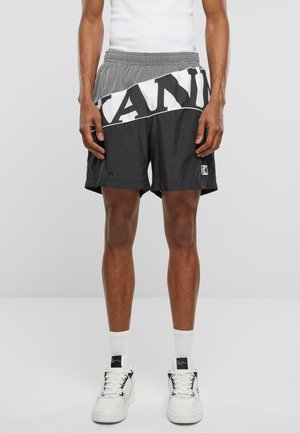 Karl Kani Pantaloni sportivi - black white