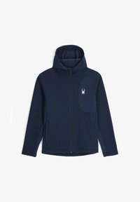 Chaqueta navy con cremallera, con diseño ribeteado texturizado, capucha y un bolsillo con cremallera en el pecho que cuenta con un logo de araña blanca en el lado izquierdo.