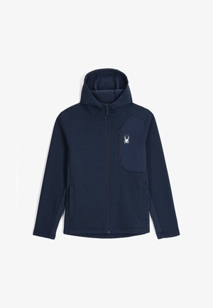 Marinefarbener Zip-Up-Jacke mit strukturiertem Rippendesign, Kapuze und einer mit Reißverschluss versehenen Brusttasche, die auf der linken Seite ein weißes Spinnenlogo trägt.