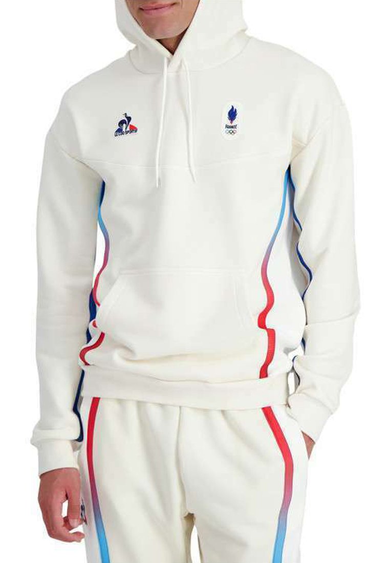 Sudadera blanca con bolsillo tipo canguro, con rayas laterales azules y rojas. Incluye logotipos bordados de Francia y de la llama olímpica.
