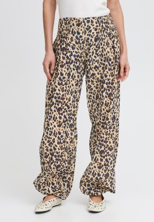 Leopard print, wide-leg pants made of lightweight fabric with a smocked waistband. Color palette includes beige, brown, and blue spots.