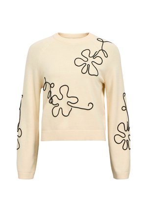 Pull crème avec broderie florale noire. Doté de manches longues, de poignets côtelés et d'un col rond. Style court avec une coupe décontractée.