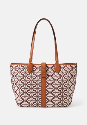 Tote bag featuring a maroon fabric with white floral pattern, brown leather accents, dual handles, and a central strap with gold hardware.