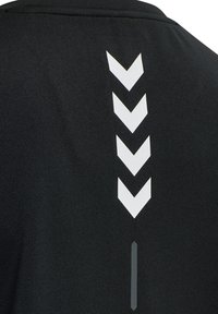 Black athletic shirt featuring a vertical row of white chevron patterns and a slim vertical accent in grey on the back.