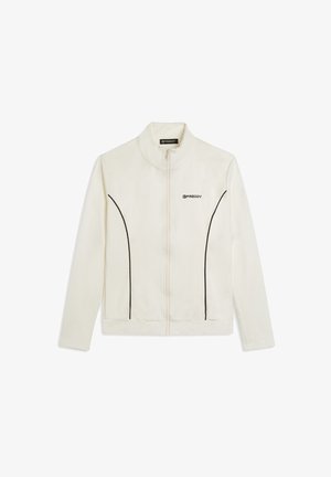 Giacca bianca con zip in materiale morbido, con collo alla coreana, dettagli in piping nero e logo sul petto sinistro.