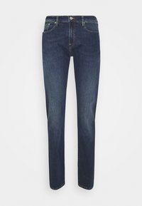 Mörkblå slim-fit jeans med frontknapp och dragkedja, fram- och små myntfickor, visade på en enfärgad vit bakgrund.