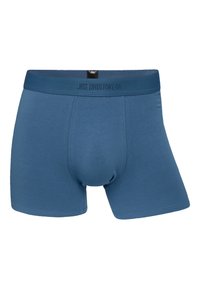 Pánské modré boxerky vyrobené z měkké elastické látky. Mají pohodlný pás se sítotiskem "JBS UNDERWEAR" v tmavém písmu.