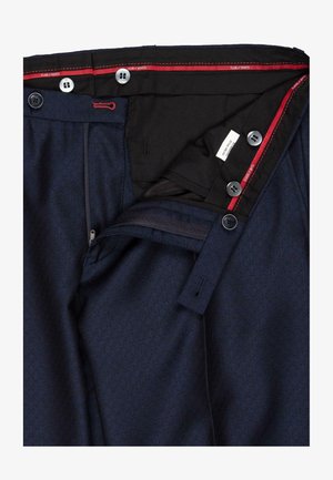 Navy blue trousers with a subtle geometric pattern, featuring a zip fly, multiple buttons, and red accents on the interior waistband.