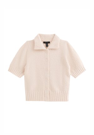 Kurzärmelige, kragenlose Strickjacke aus weichem, cremefarbenem Stoff mit strukturierter Oberfläche. Verfügt über eine Knopfleiste vorne und einen gerippten Saum.