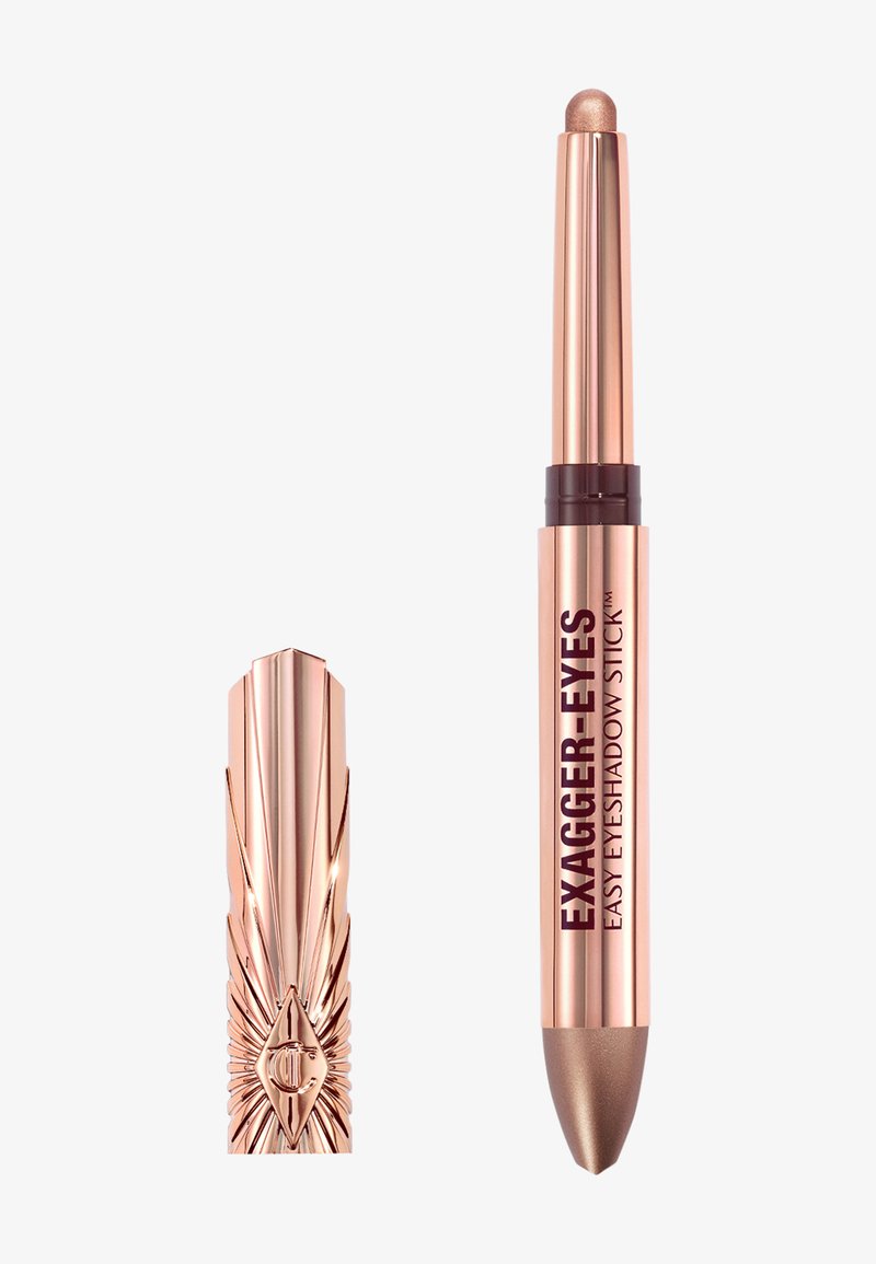 Rose gold eyeshadow stick with a twist-up design and embossed cap, labeled Exagger-Eyes Easy Eyeshadow Stick in metallic brown shade.