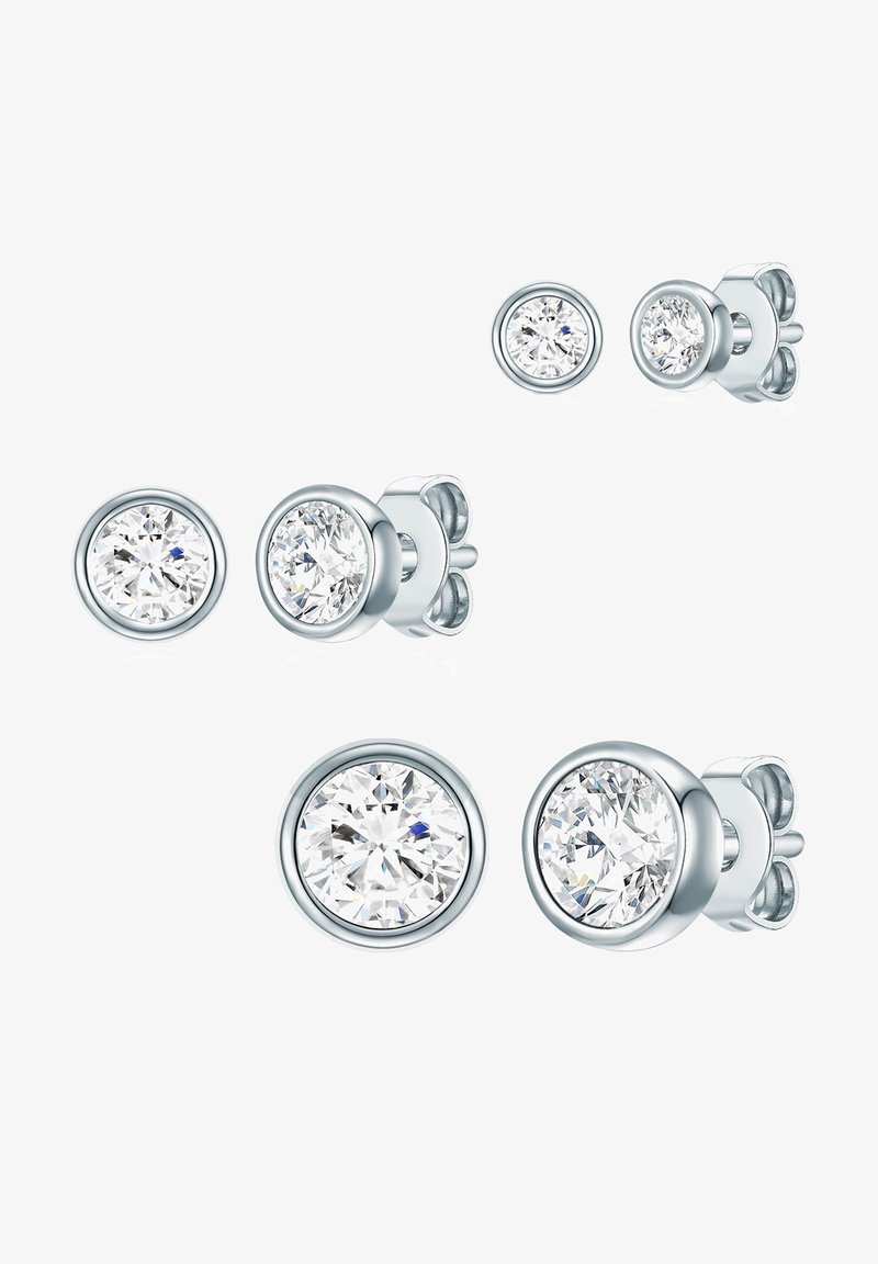 Apvalūs auskarai su skaidriu, facetuotu akmeniu, įmontuotu į poliruoto sidabro atspalvio metalinį pagrindą. Į komplektą įeina kelių dydžių poros.