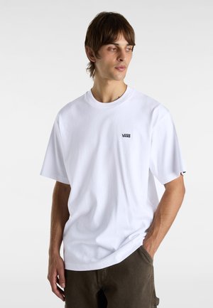 White cotton t-shirt with a round neckline and short sleeves, featuring a small black Vans logo on the left chest.