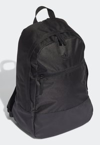 Black backpack with a smooth texture, featuring a main compartment, front zip pocket, and a loop handle on top. Accented with a small logo.