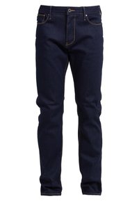 Mörkblå slim-fit jeans med orange sömmar, framknapp, dragkedja och fem fickor, visade mot en vit bakgrund.