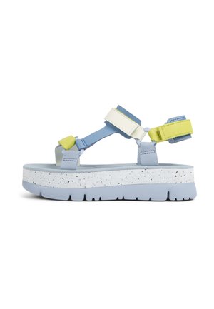 Blue and white platform sandal featuring color-block straps in blue, green, and white, with a speckled sole and adjustable hardware.