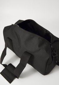 Björn Borg GYM BAG UNISEX - Športová taška - black beauty