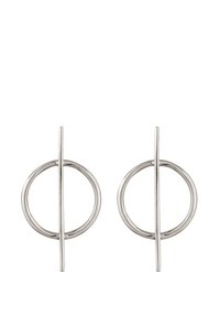 Silverfärgade metallörhängen med en cirkulär design och en vertikal linje som korsar mitten. Slät yta med en modern estetik.