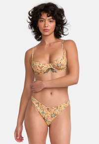 Floral bikini set in pastel colors, featuring a textured pattern, adjustable straps, and a classic cut top with a matching bottom.