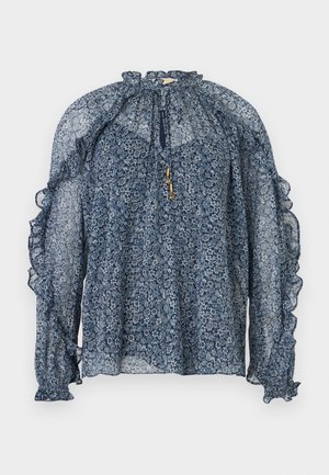 Διάφανη μακρυμάνικη μπλούζα σε ναυτικό μπλε με φλοράλ μοτίβο, βολάν, ψηλό γιακά με άνοιγμα και κορδόνια με χρυσές άκρες, και ελαστικές μανσέτες.