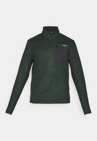 Pull-over en polaire à manches longues vert foncé, avec un zip quart et une poche poitrine zippée noire, arborant un logo de marque.