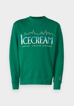 Green cotton sweater featuring a skyline graphic. Text reads “ICECREAM” and “LONDON UNITED KINGDOM.” Includes ice cream cone logo on sleeve.