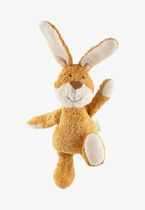 Plüschkaninchen-Spielzeug mit plüschigem orange-braunem Körper, weißen Akzenten an Ohren und Pfoten, weichem Stoff und einem lächelnden Gesicht. Arme erhoben.