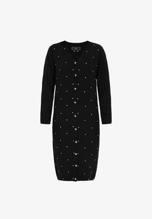 Cardigan noir à manches longues avec un col en V, orné de pois blancs et de boutons métalliques sur le devant. Tissu doux et texturé.