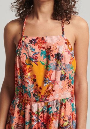 Vícebarevné šaty s lehce oranžovým základem, zdobené květinovými a zvířecími vzory. Špagetová ramínka a skládací sukně.