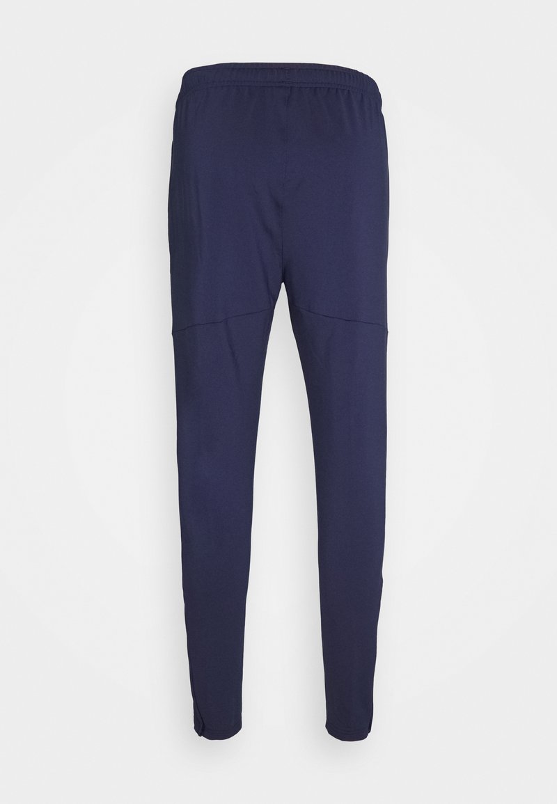 Puma TEAMLIGA TRAINING PANTS PRO - Teplákové kalhoty - peacoat/white
