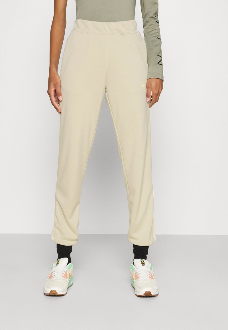 Nike Sportswear TAPE Tracksuit bottoms light stone/beige Zalando.de
