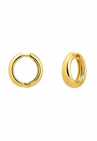 Pendientes de aro de oro con un acabado suave y brillante. Forma redondeada, con cierre de bisagra y una superficie interior ligeramente texturizada.