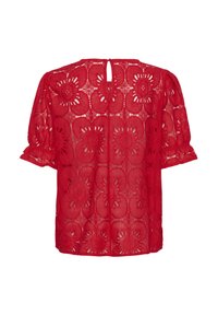 Blouse en dentelle rouge avec des manches courtes bouffantes et un col rond. Motif floral avec des découpes et une ouverture en forme de trou de serrure au dos.