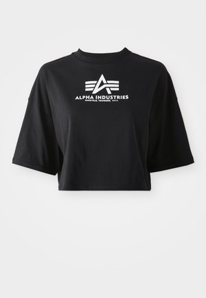 Black cropped t-shirt made of cotton, featuring short sleeves and a round neckline. Displays a white printed logo with geometric accents.