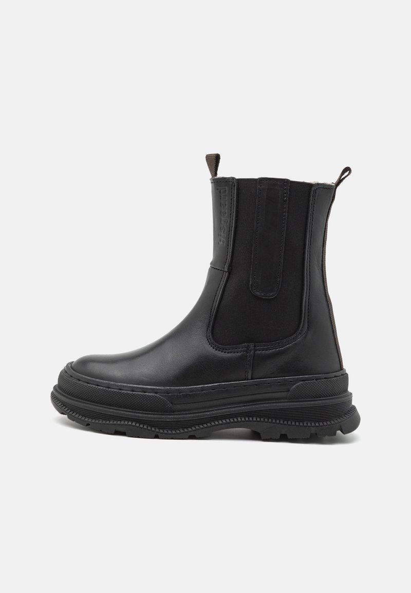 Black leather ankle boots featuring elastic side panels, ribbed detailing, and a thick rubber sole with textured grip.