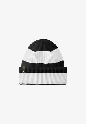 Knitted beanie with alternating black and white stripes, featuring a ribbed texture and a folded cuff. Includes a small logo tag.
