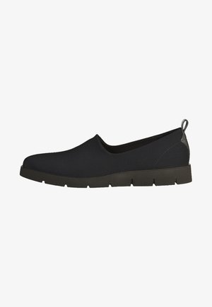 Musta slip-on-kengät, joissa on sileä kangasvarsi, tekstuurilla varustettu kumipohja ja minimalistinen muotoilu, jossa on pieni vetovaljaat kantapäässä.
