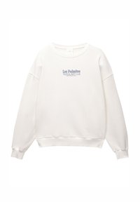 Sweat-shirt blanc à manches longues et col rond avec le texte « Los Palmitos Tropical Party Club Gran Canaria, Spain » imprimé en bleu, centré sur la poitrine.
