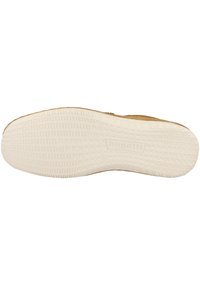 Beige sula med texturerat mönster och varumärket "bugatti" präglat. Mjuk gummimaterial med en flexibel design för komfort och grepp.