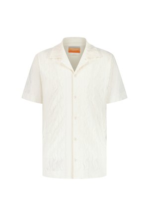 Chemise à manches courtes en blanc cassé, dotée d'un motif texturé en vagues, d'un col et d'une fermeture à boutons sur le devant.
