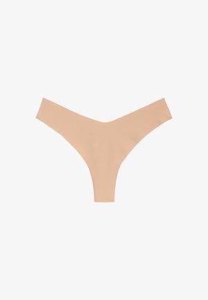 Beige thong underwear with a smooth texture and minimalistic v-shape design. Wide waistband and no visible stitching for a seamless look.