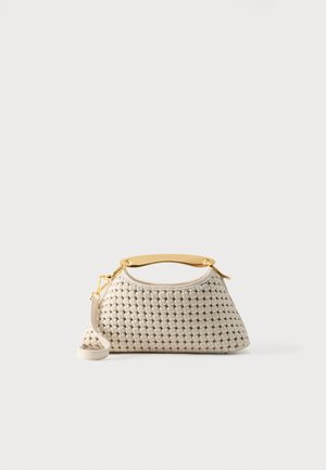Small white woven handbag with a gold metal top handle and an attached white leather shoulder strap on a plain background.