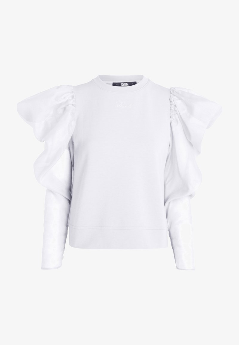Camiseta blanca de manga larga con mangas de organza abullonadas y sutil bordado "Karl" en el pecho, con un escote redondo.