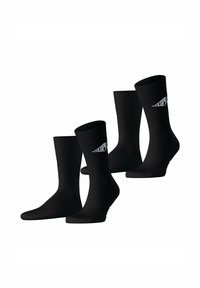 Schwarze Sportsocken, gerippter Design, mittlere Schafthöhe, mit einem weißen Logo-Detail auf einer Seite. Glatte Textur, vier Paare angezeigt.