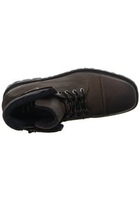 Braune Leder-Stiefelette mit strukturiertem Obermaterial, schwarzen Schnürsenkeln, gepolstertem Kragen und Gummisohle. Verfügt über Metallösen und Fleece-Futter.