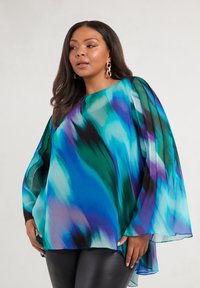 Long-sleeve, flowing blouse in teal and blue gradient with abstract patterns. Features a relaxed fit and slightly sheer fabric.